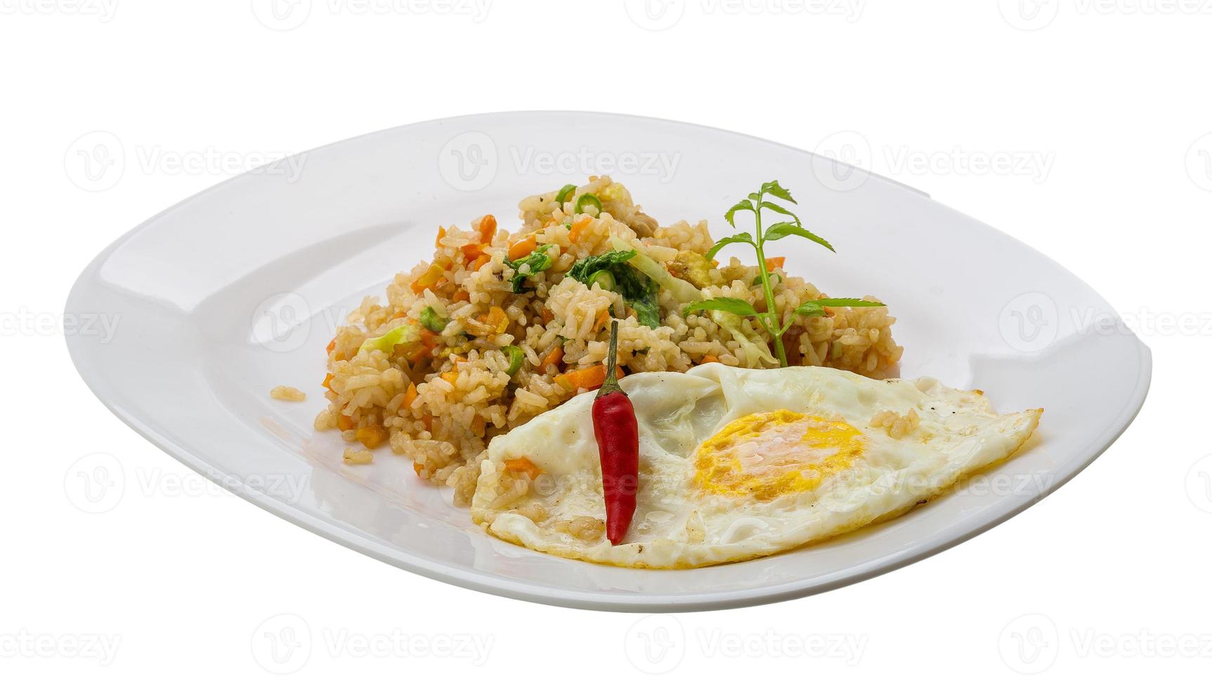 Fried rice with egg on the plate and white background photo