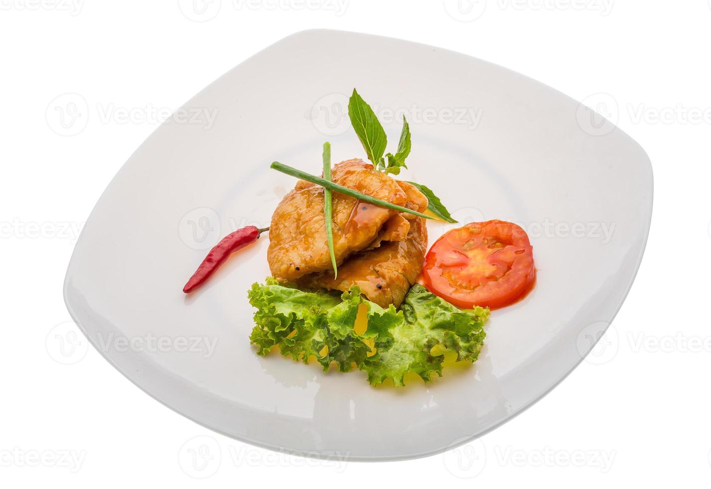 Baracuda steak on the plate and white background photo