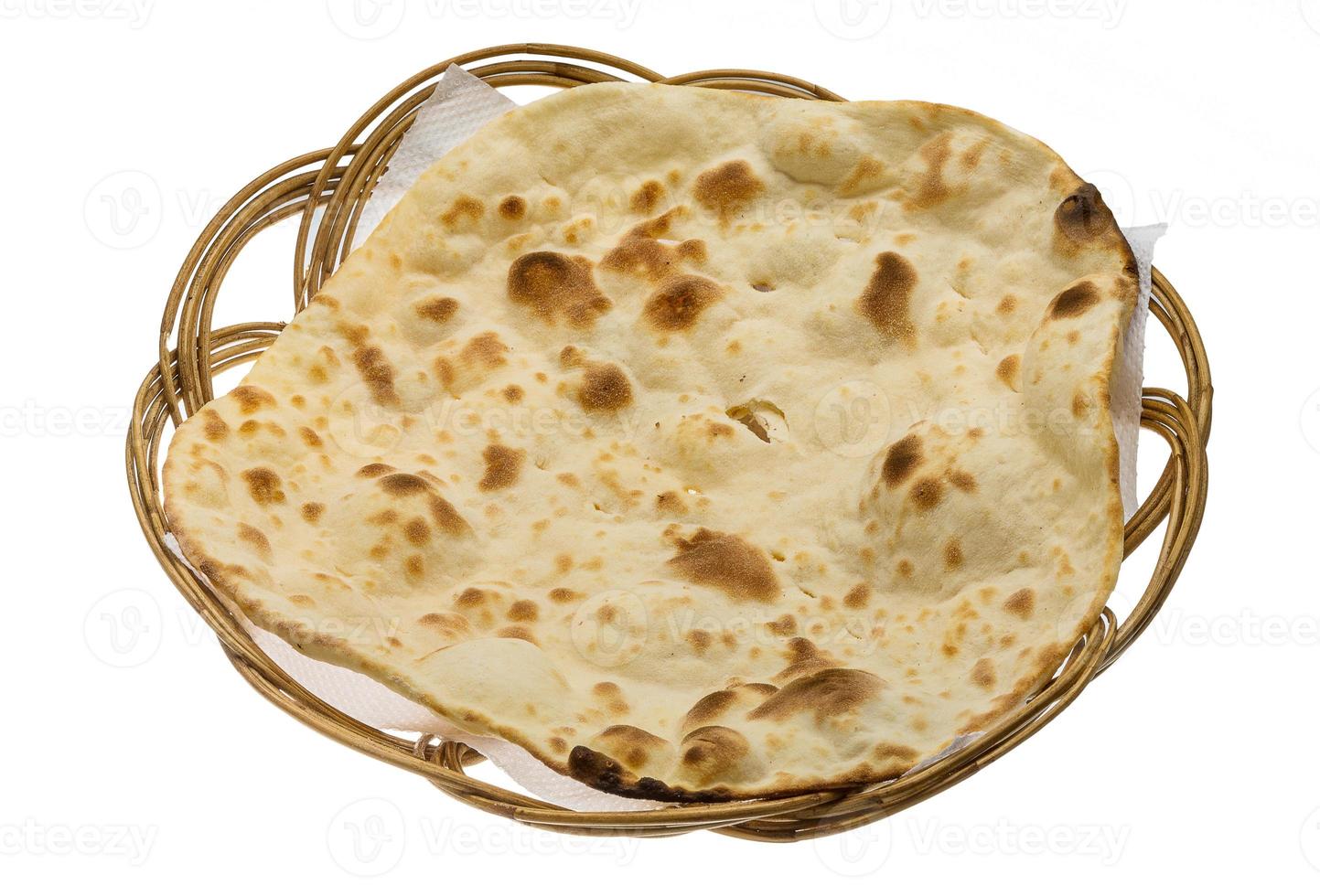 Plain Naan in a basket on white background photo