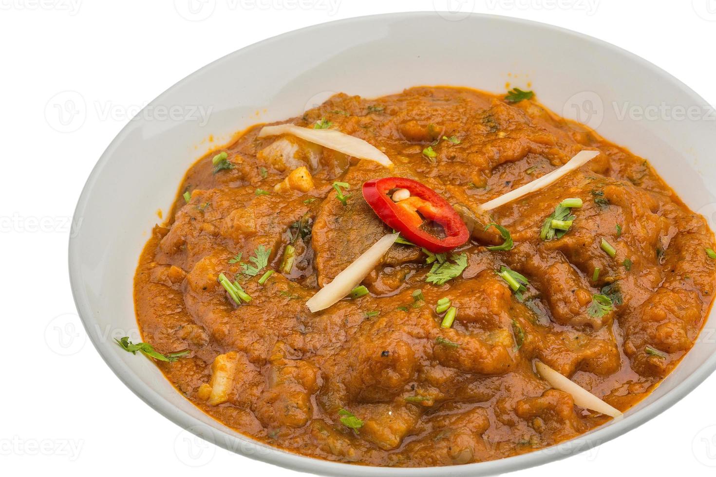 Lamb vindaloo in a bowl on white background photo