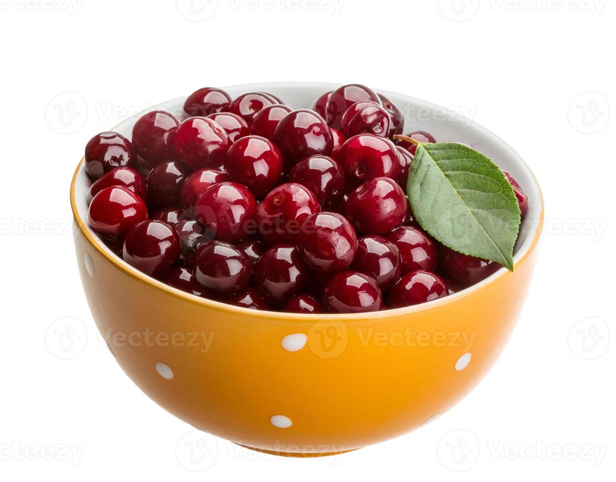 Cherry in the bowl on white background photo