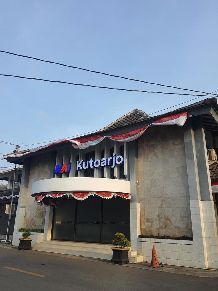 Sign at the entrance of the Kutoarjo train station at noon. photo