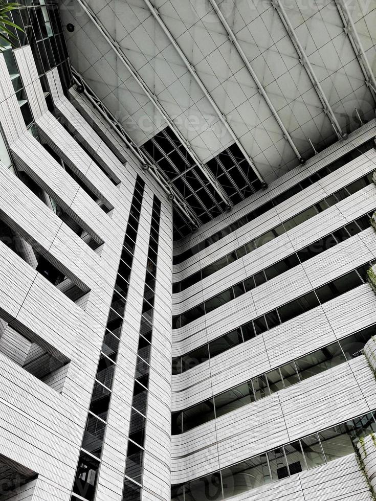 West Java, Indonesia on July 2022. The inside of a tall building, lots of glass and very futuristic. photo