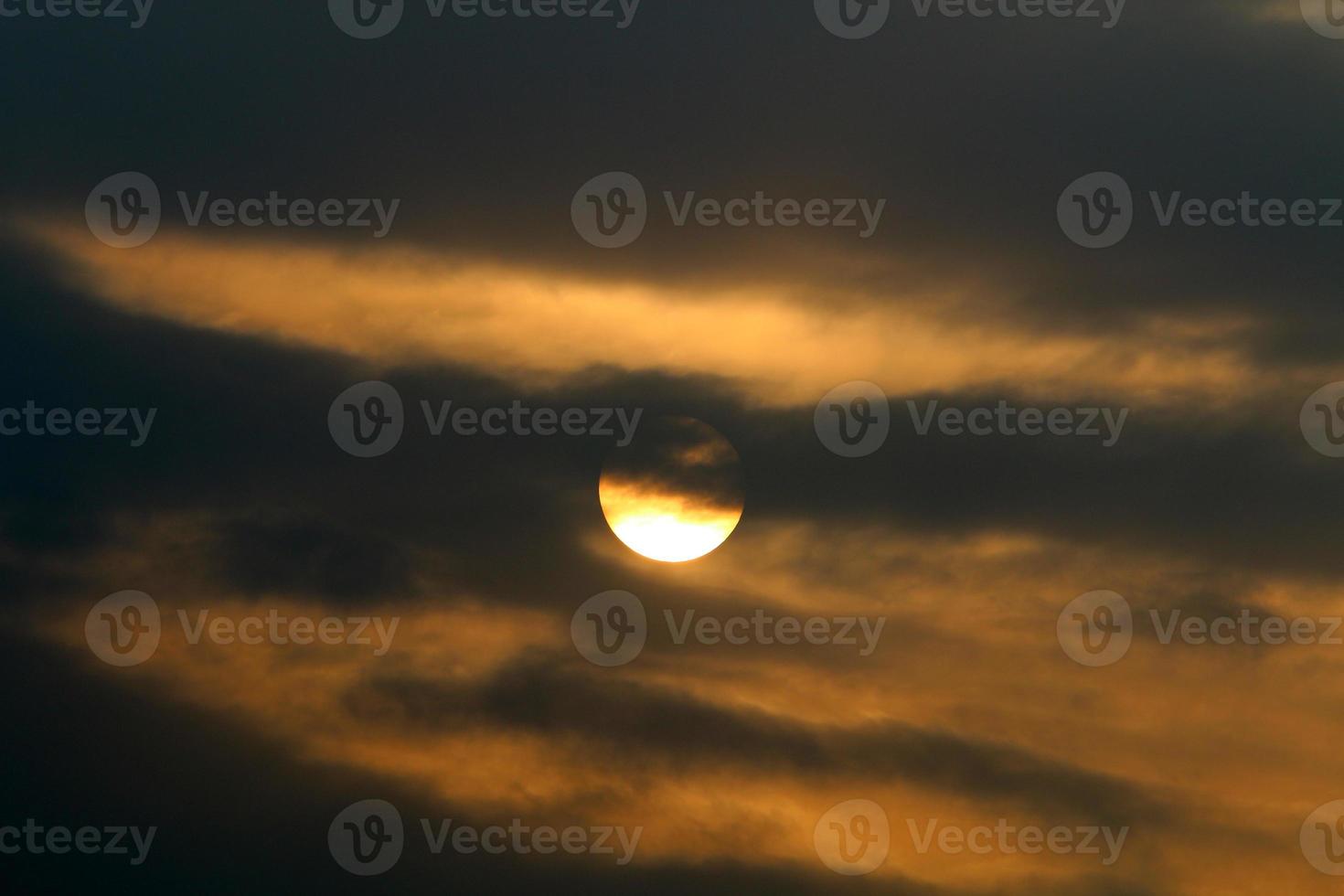 The sun sets below the horizon on the Mediterranean Sea in northern Israel. photo