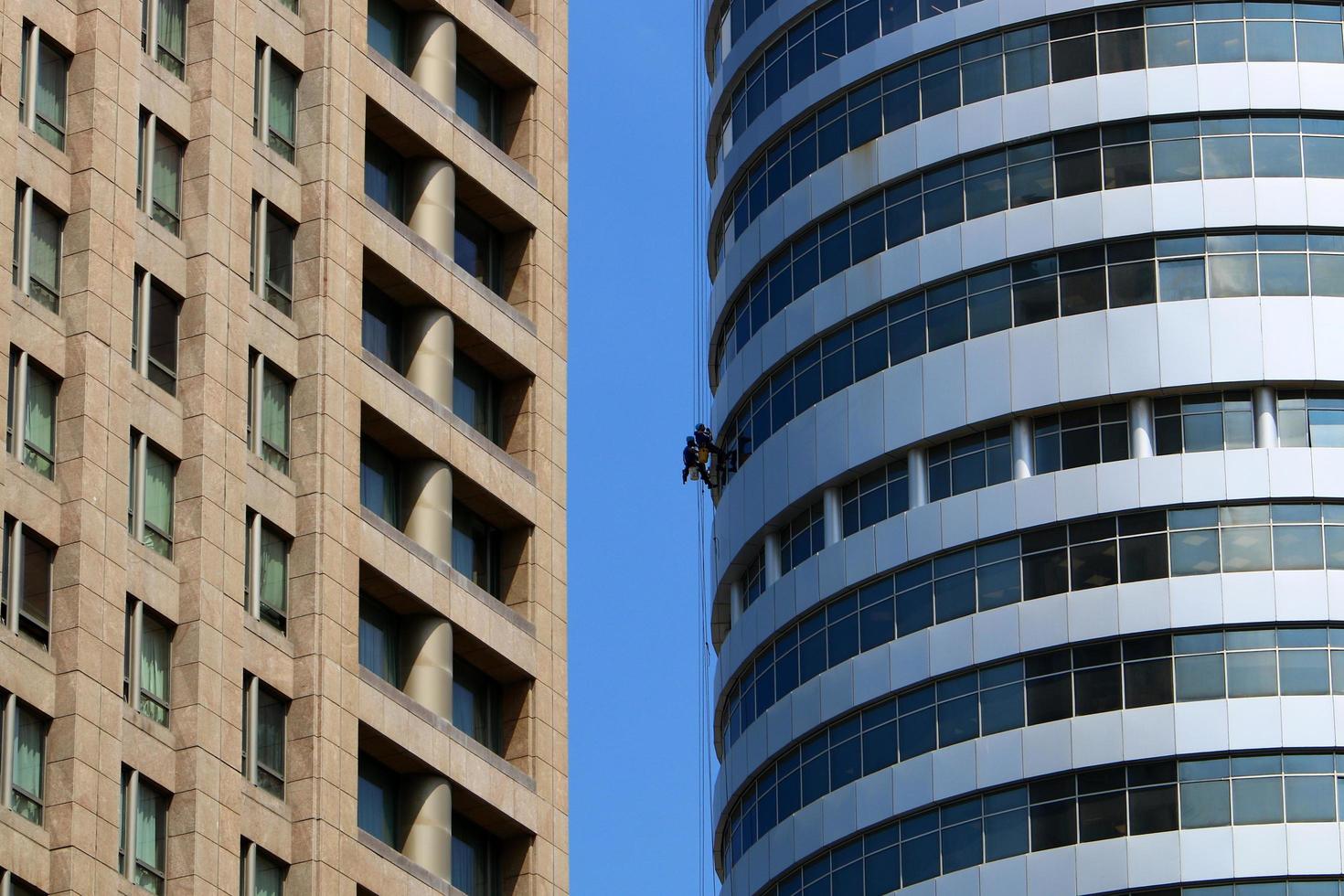 Tel Aviv Israel February 2, 2020. The work of high-rise workers on the walls of a skyscraper. photo