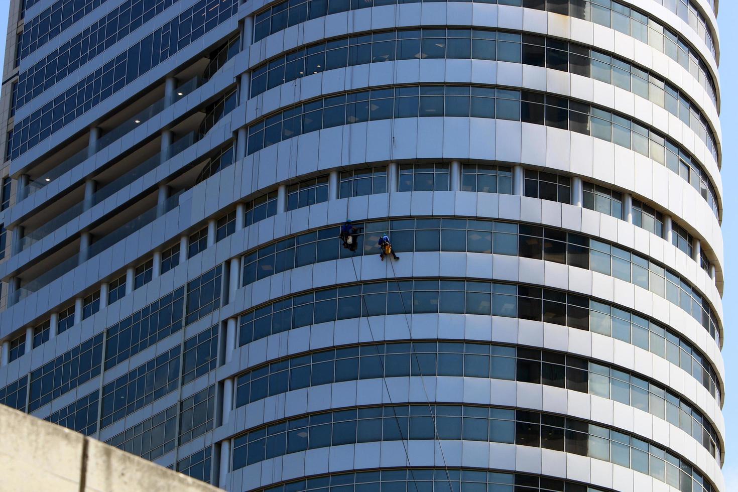 Tel Aviv Israel February 2, 2020. The work of high-rise workers on the walls of a skyscraper. photo