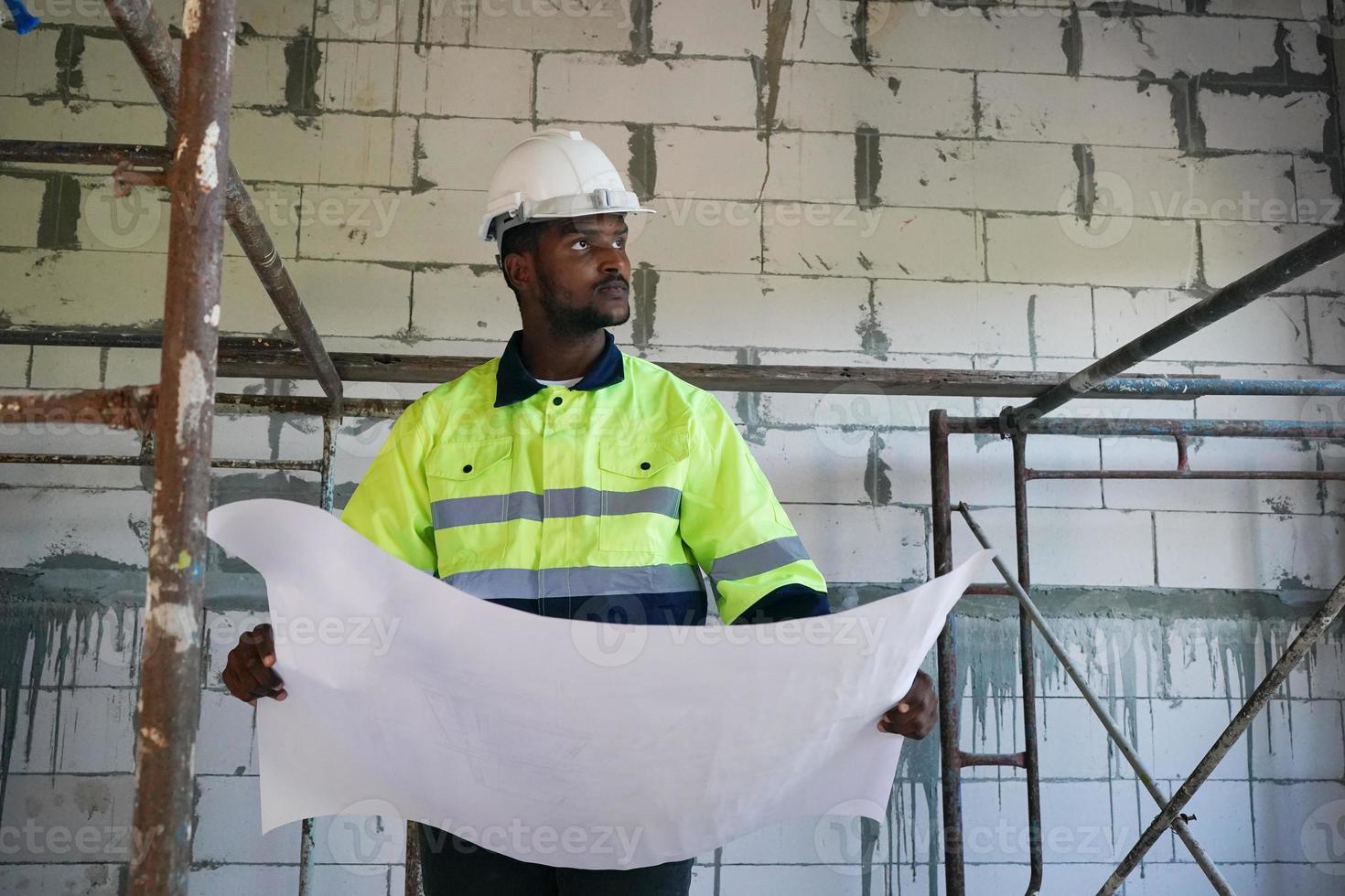 Architect and construction engineer or surveyor discussion plans and blueprints photo