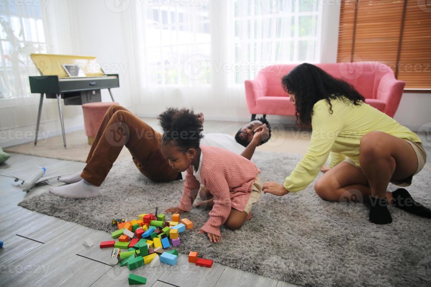 Joyful multiethnic family and their leisure at home photo