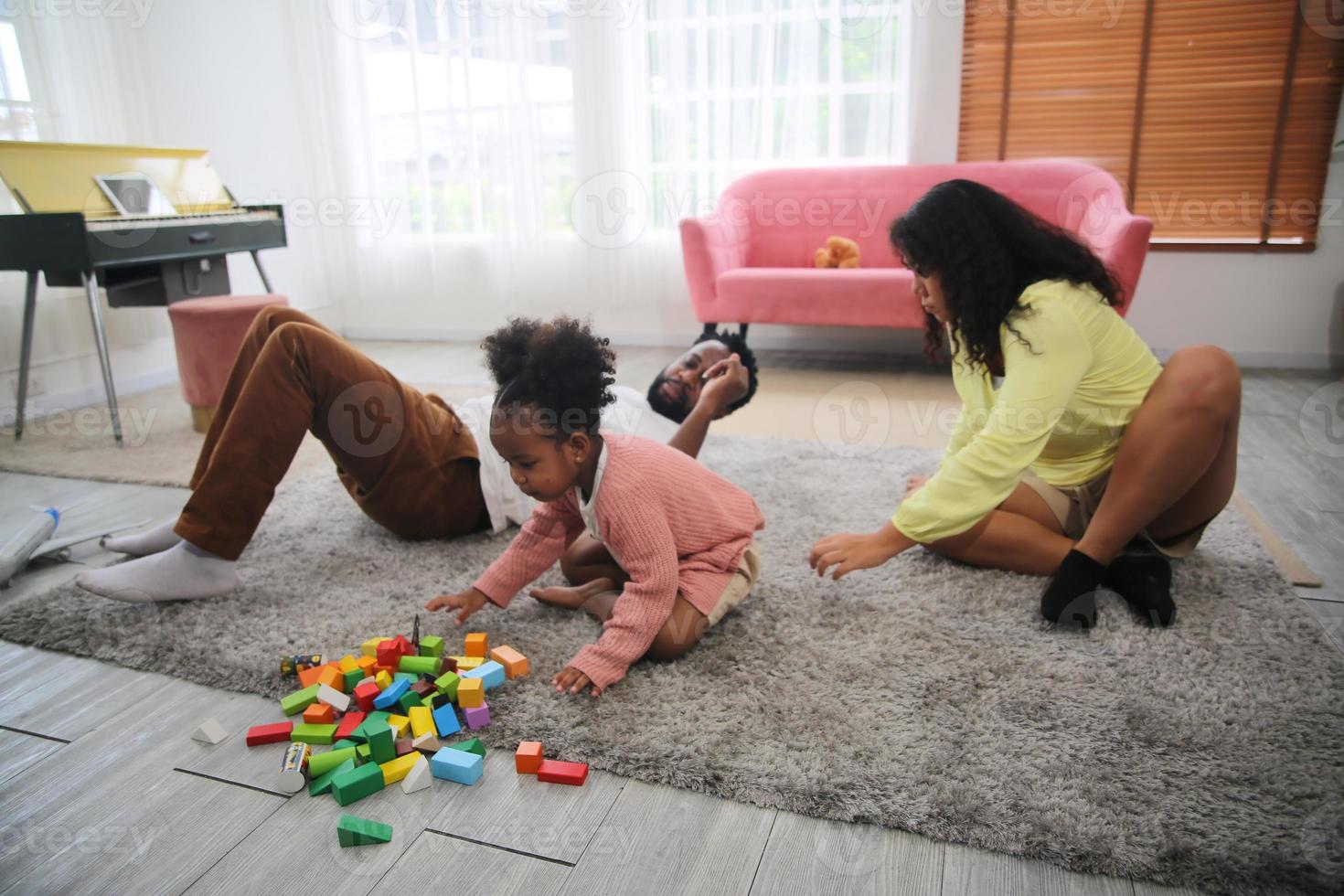 Joyful multiethnic family and their leisure at home photo