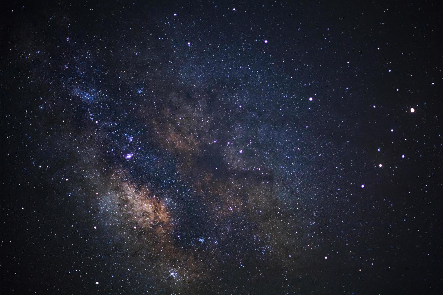 Close up of Milky way galaxy with stars and space dust in the universe, Long exposure photograph, with grain. photo