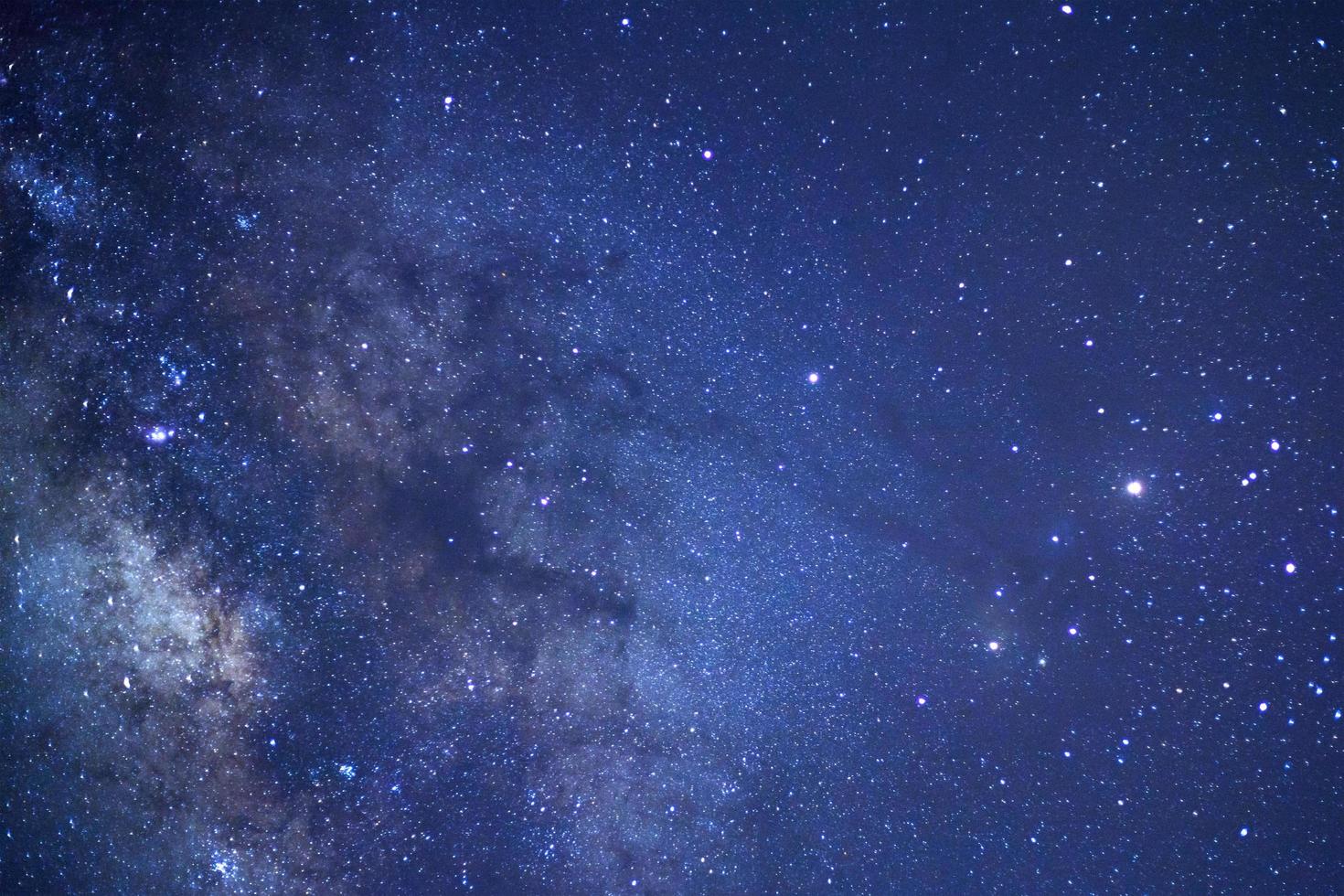 Milky way galaxy with stars and space dust in the universe, Long exposure photograph, with grain. photo