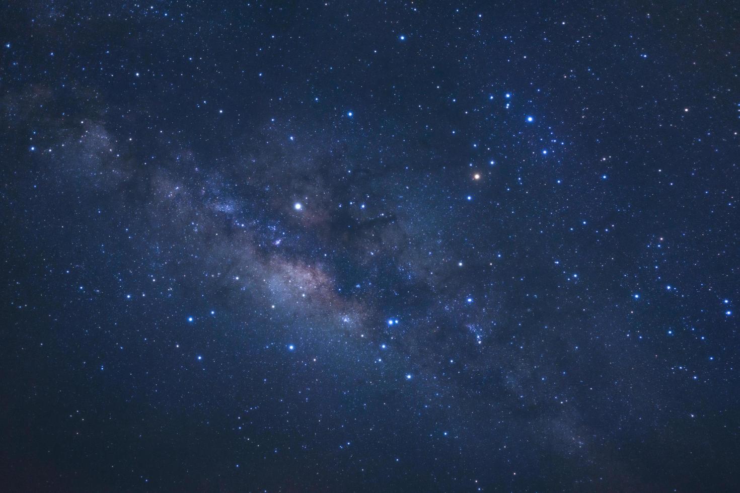 Milky way galaxy with stars and space dust in the universe, Long exposure photograph, with grain. photo