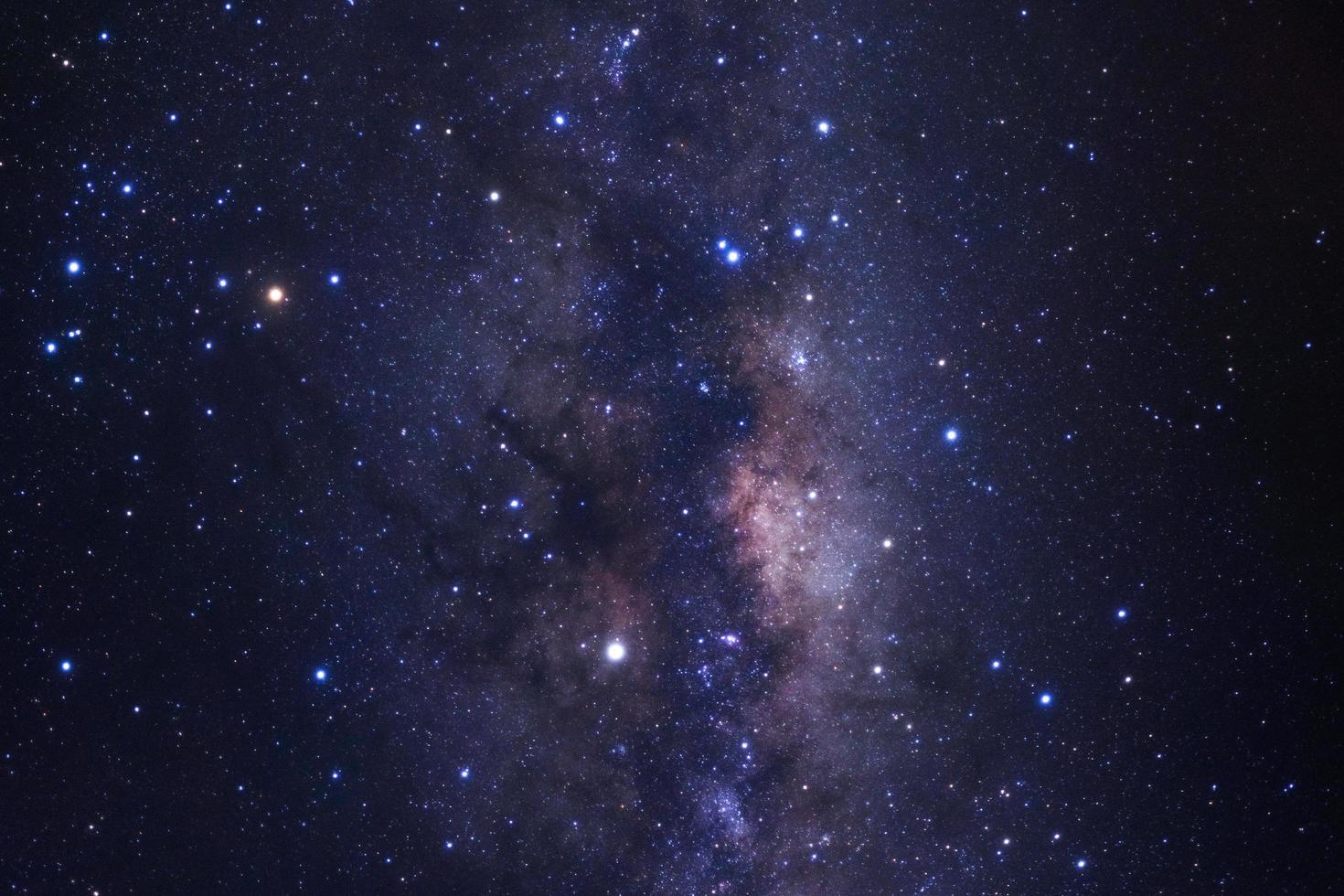 Milky way galaxy with stars and space dust in the universe, Long exposure photograph, with grain. photo