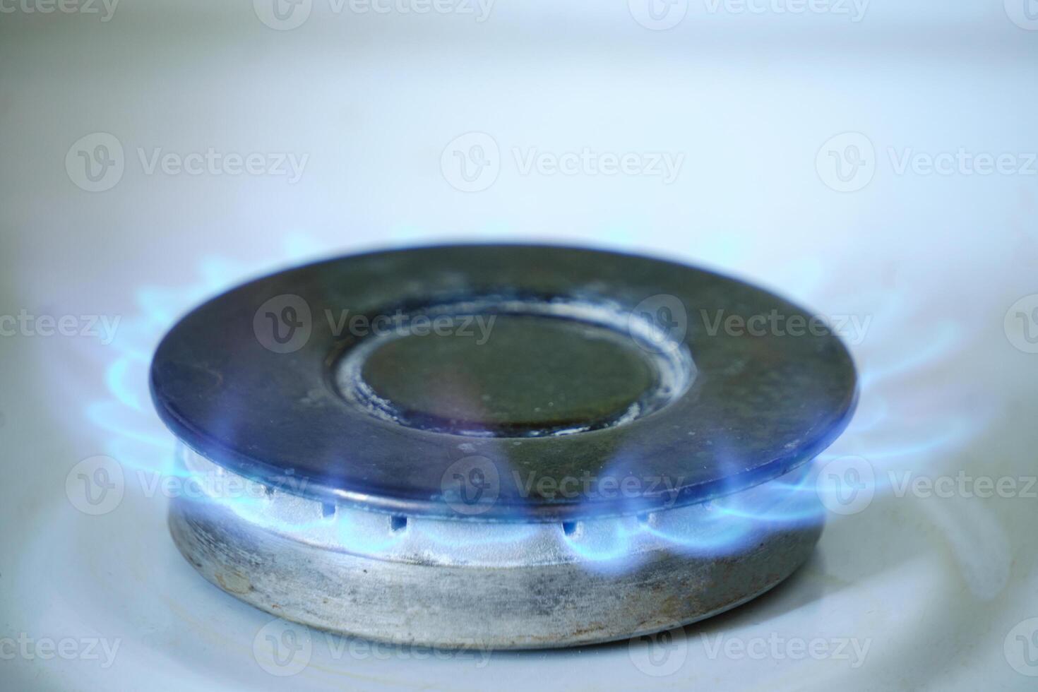 Blue flame on burning gas stove burner. 11246193 Stock Photo at Vecteezy