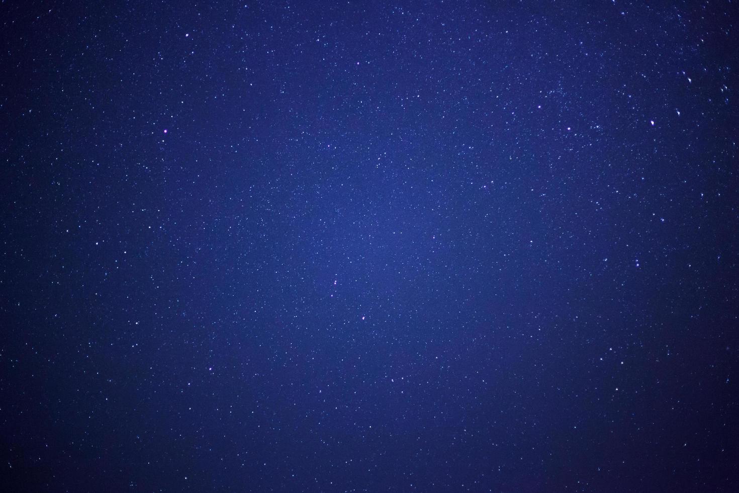Starry night sky and milky way galaxy with stars and space dust in the universe photo