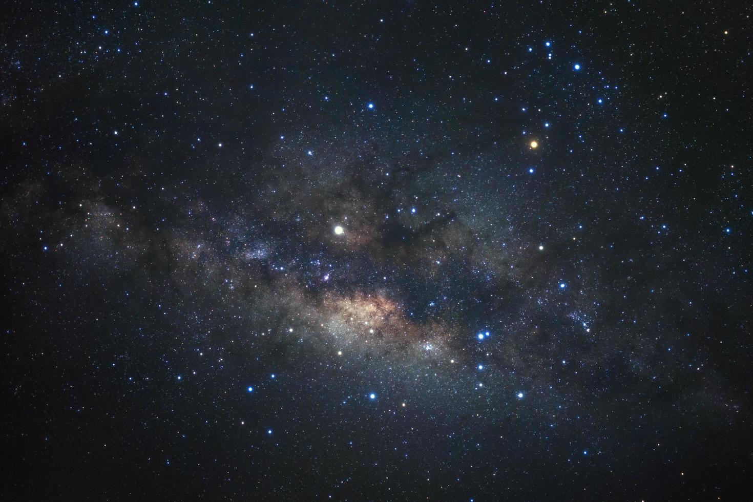 Milky way galaxy with stars and space dust in the universe, Long exposure photograph, with grain. photo