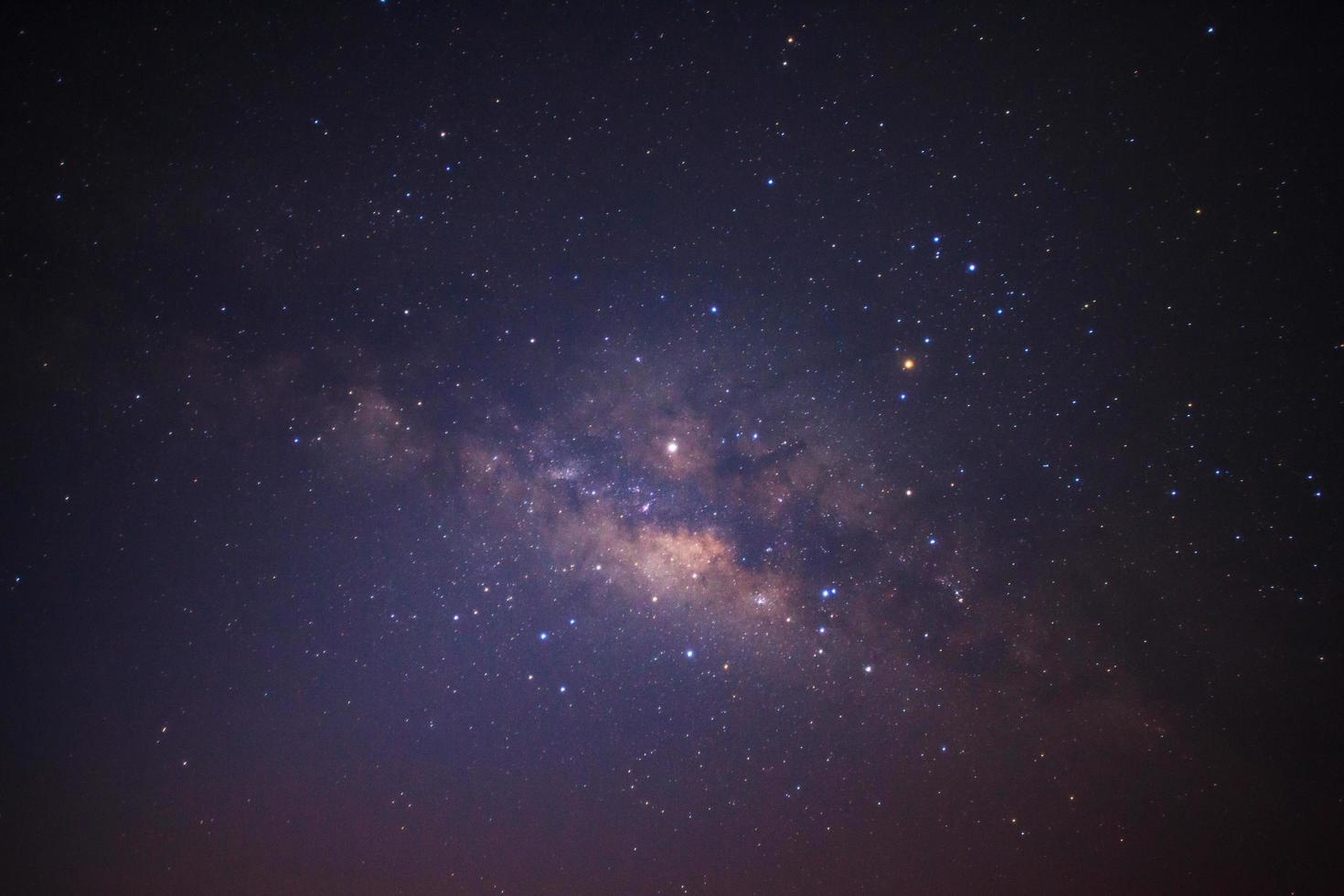 Milky way galaxy with stars and space dust in the universe, Long exposure photograph, with grain. photo