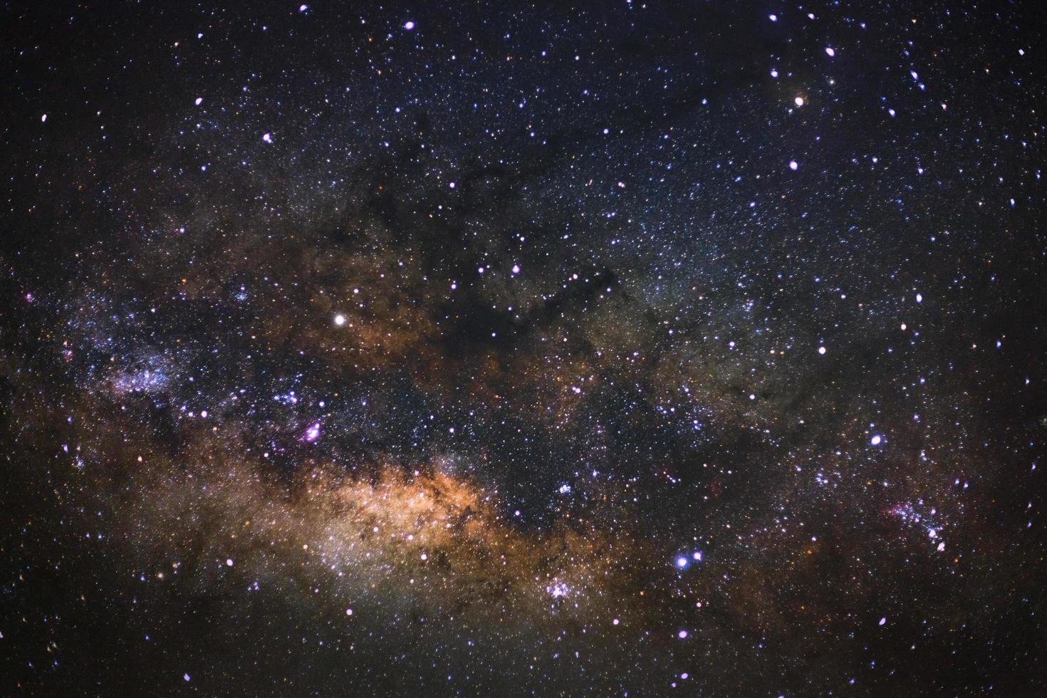 Milky way galaxy with stars and space dust in the universe, Long exposure photograph, with grain. photo