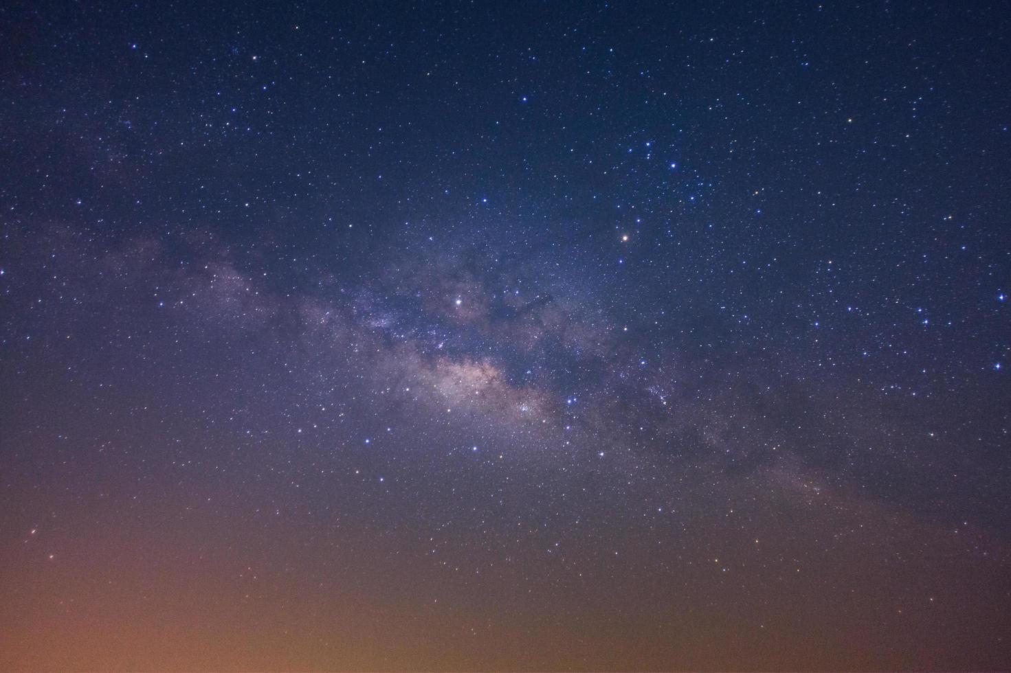 The milky way galaxy with stars and space dust in the universe, Long exposure photograph, with grain photo