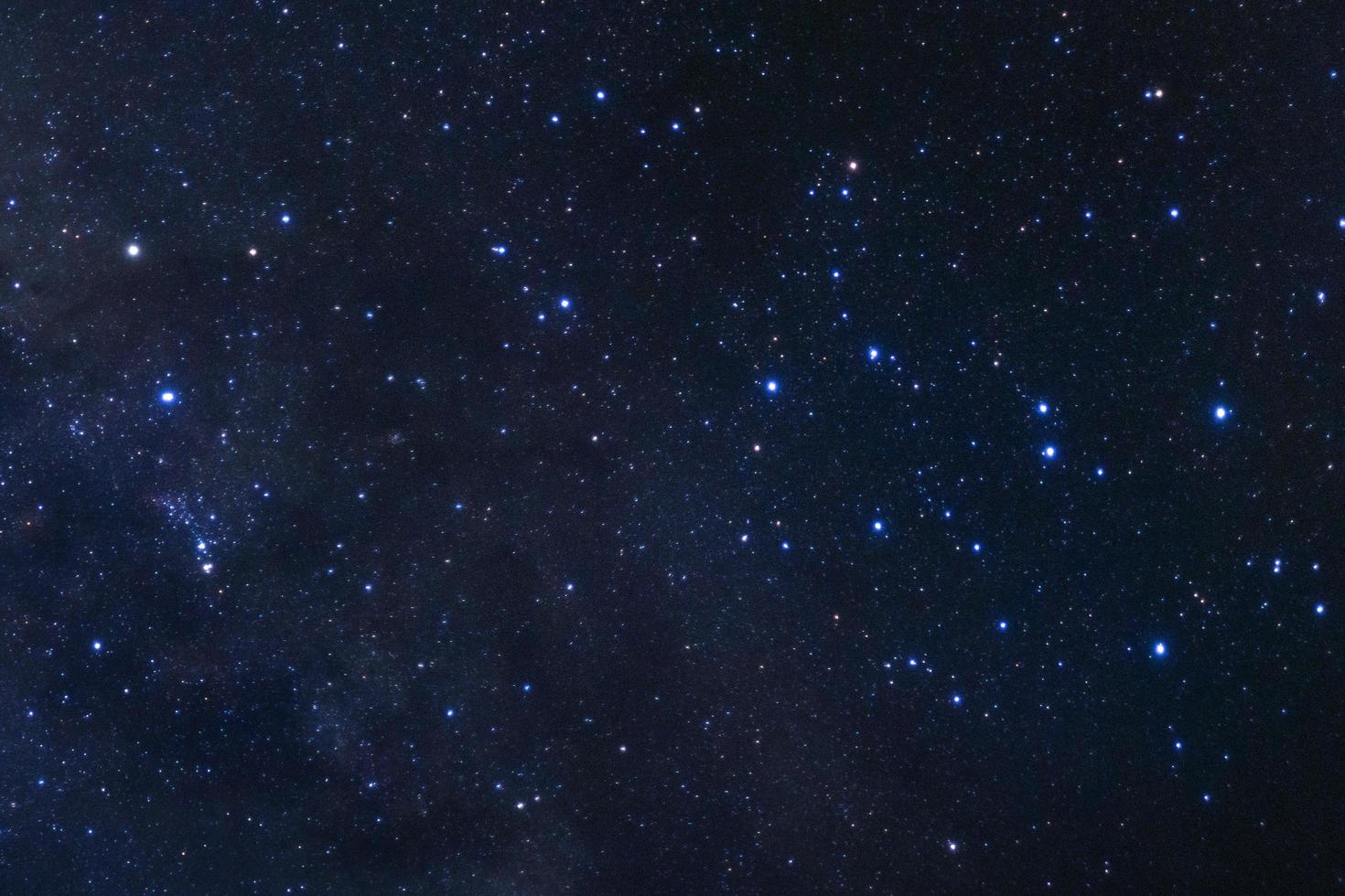 Starry night sky, Milky way galaxy with stars and space dust in the universe, Long exposure photograph, with grain. photo