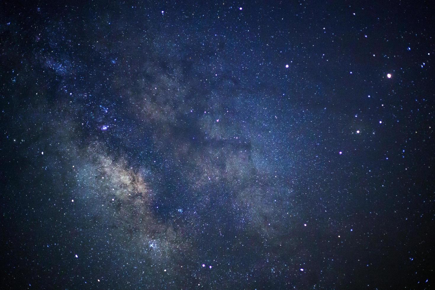 Milky way galaxy with stars and space dust in the universe, Long exposure photograph, with grain. photo