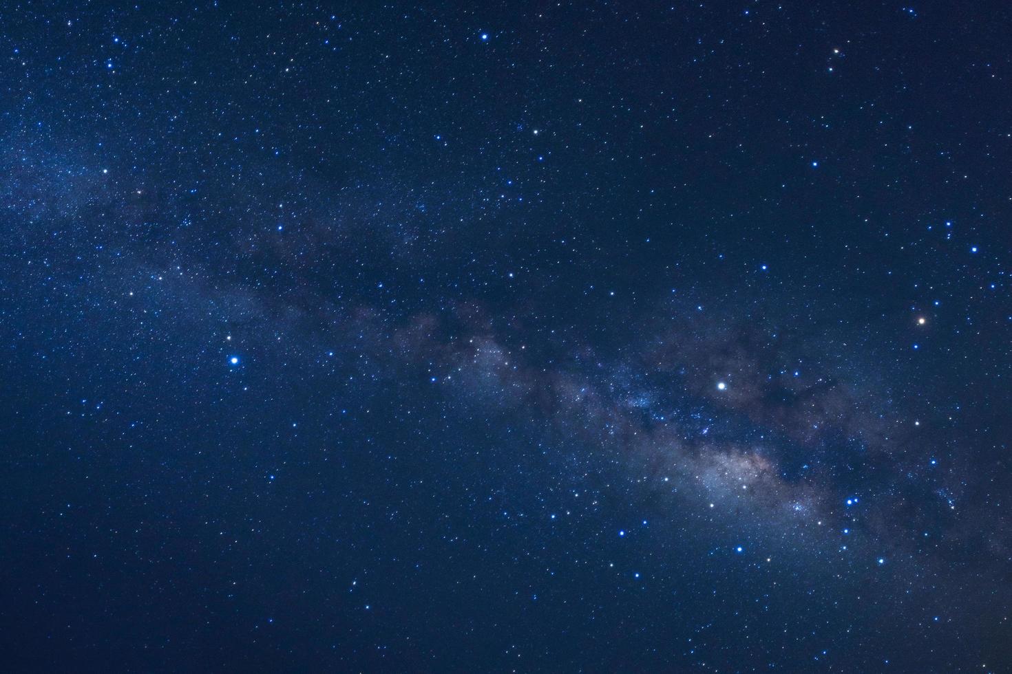 Starry night sky and milky way galaxy with stars and space dust in the universe photo