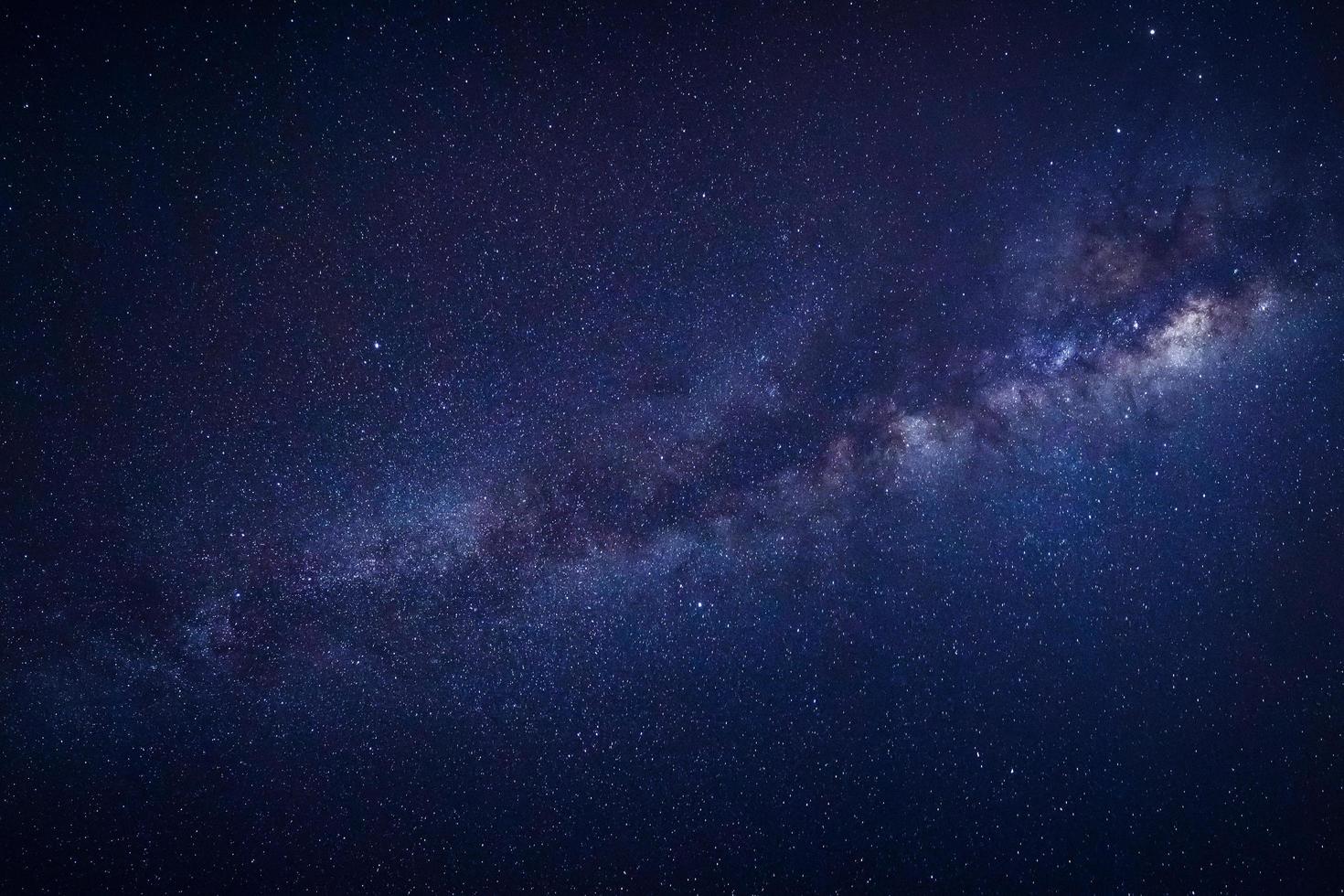 Milky way galaxy with stars and space dust in the universe, Long exposure photograph, with grain. photo