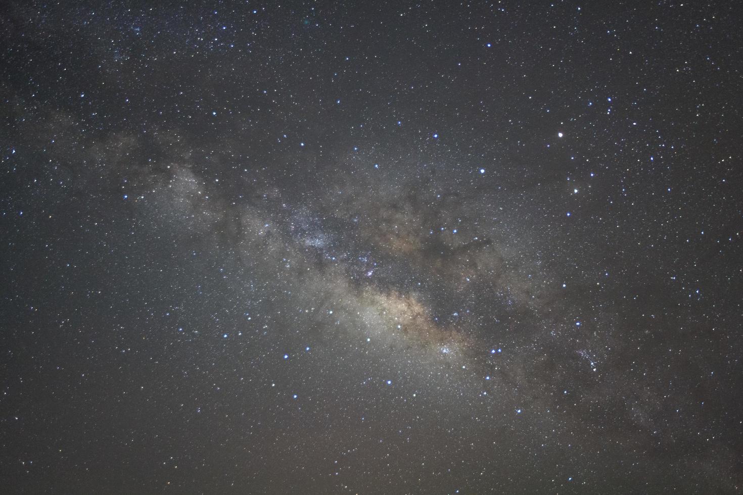 Milky way galaxy with stars and space dust in the universe, Long exposure photograph, with grain. photo