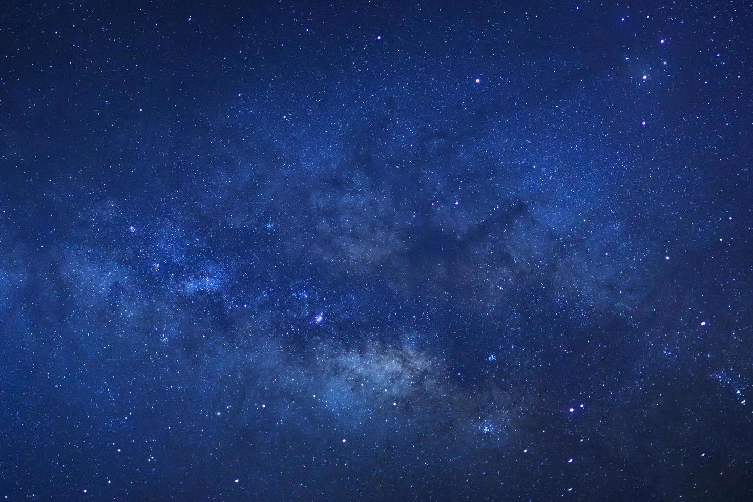 The Center of Milky way galaxy with stars and space dust in the universe, Long exposure photograph, with grain. photo
