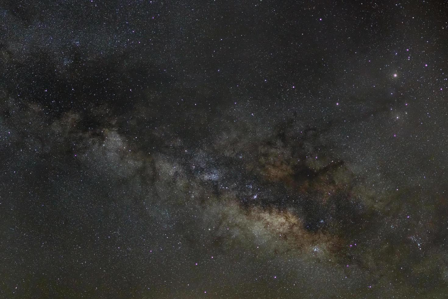 Milky way galaxy with stars and space dust in the universe, Long exposure photograph, with grain. photo