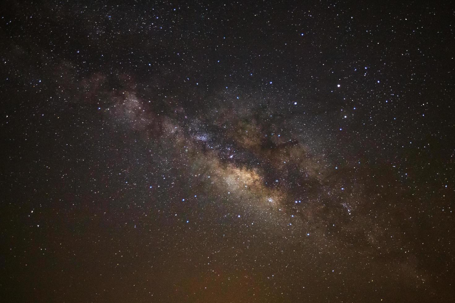 Starry night sky and milky way galaxy with stars and space dust in the universe photo