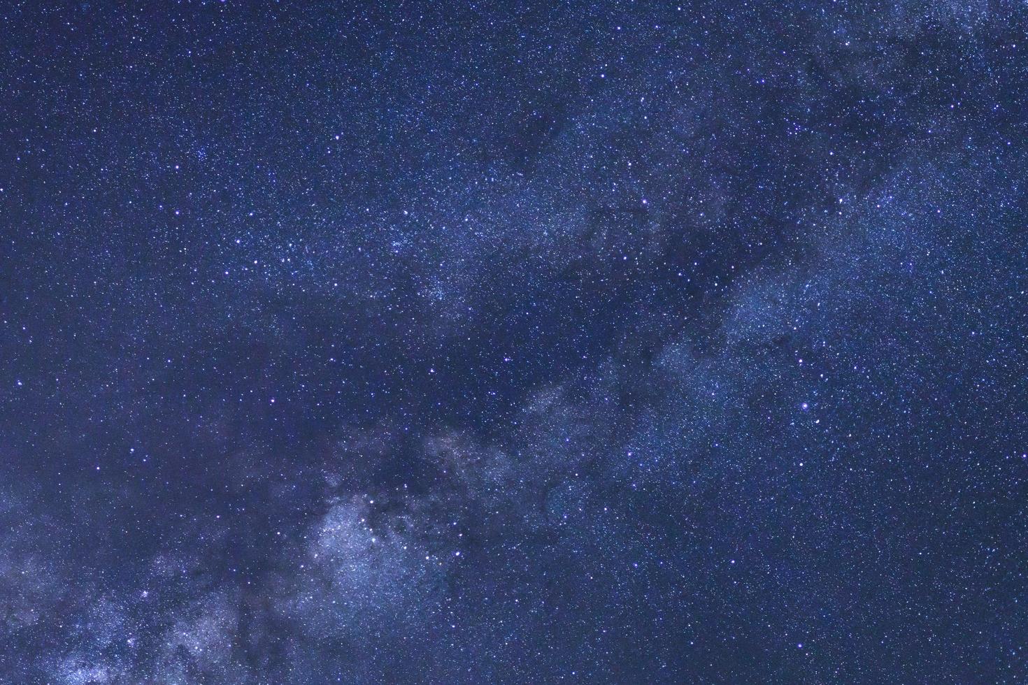 Starry night sky and milky way galaxy with stars and space dust in the universe photo