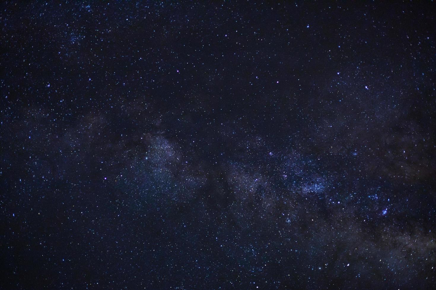 Close up of Milky way galaxy with stars and space dust in the universe, Long exposure photograph, with grain. photo