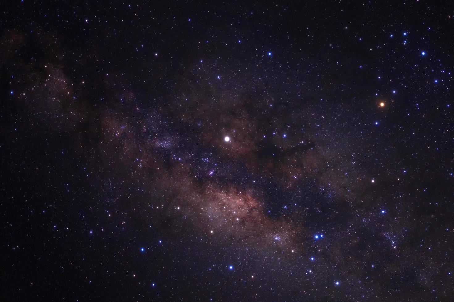 Milky way galaxy with stars and space dust in the universe, Long exposure photograph, with grain. photo