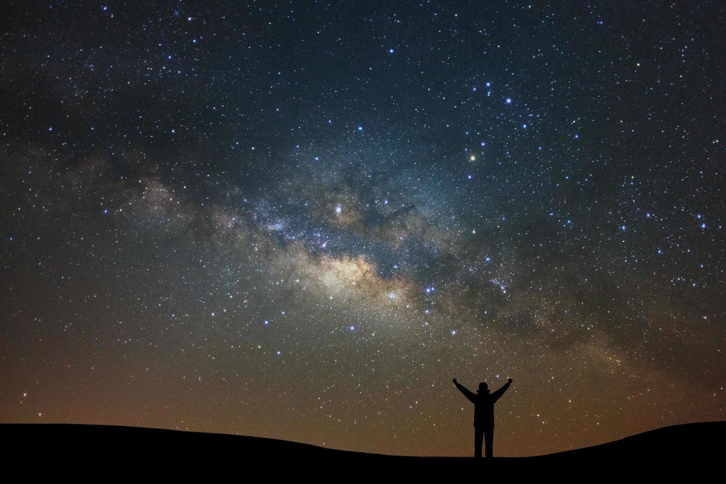 Night landscape with milky way and silhouette of high mountain, Starry sky with stars. Beautiful universe. Space background photo