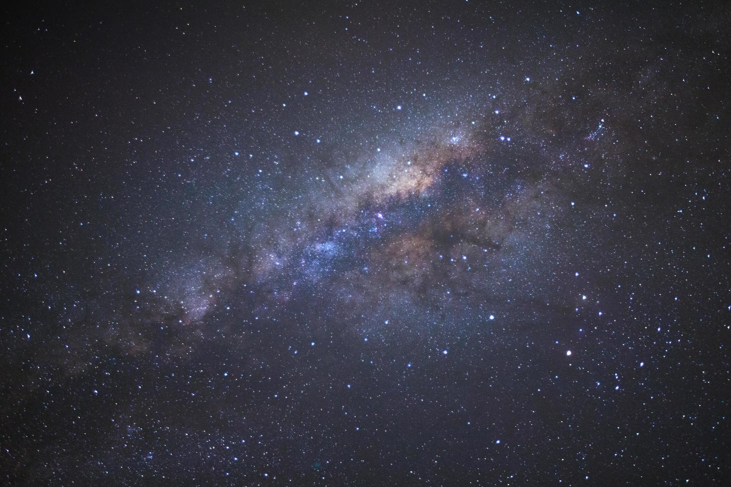 Milky way galaxy with stars and space dust in the universe, Long exposure photograph, with grain. photo