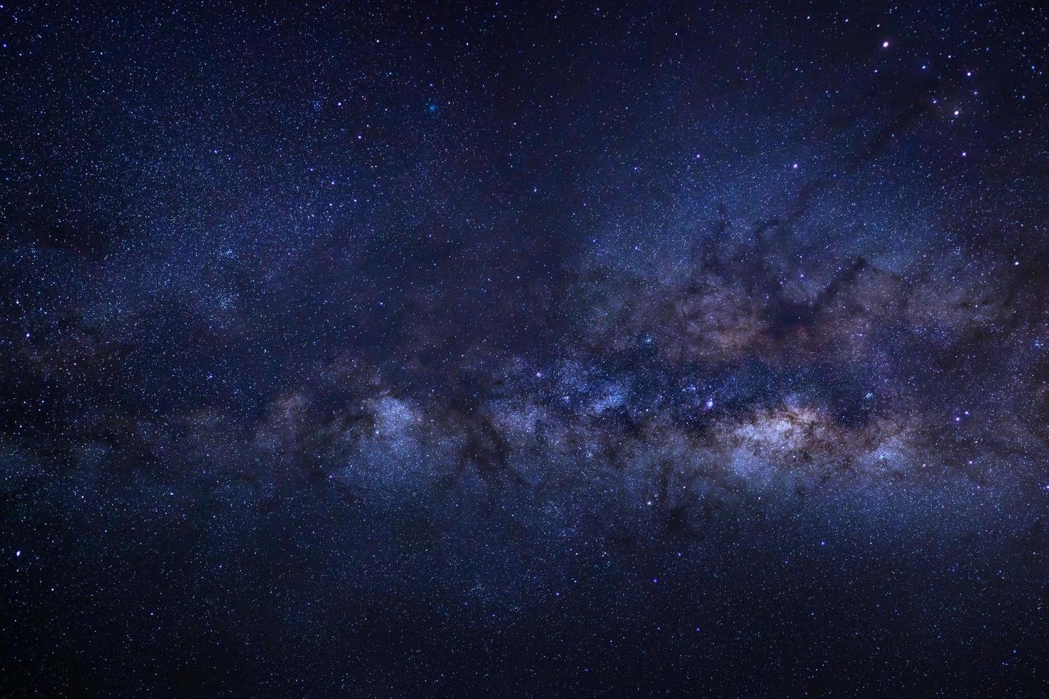 The center of Milky way galaxy with stars and space dust in the universe, Long exposure photograph, with grain. photo