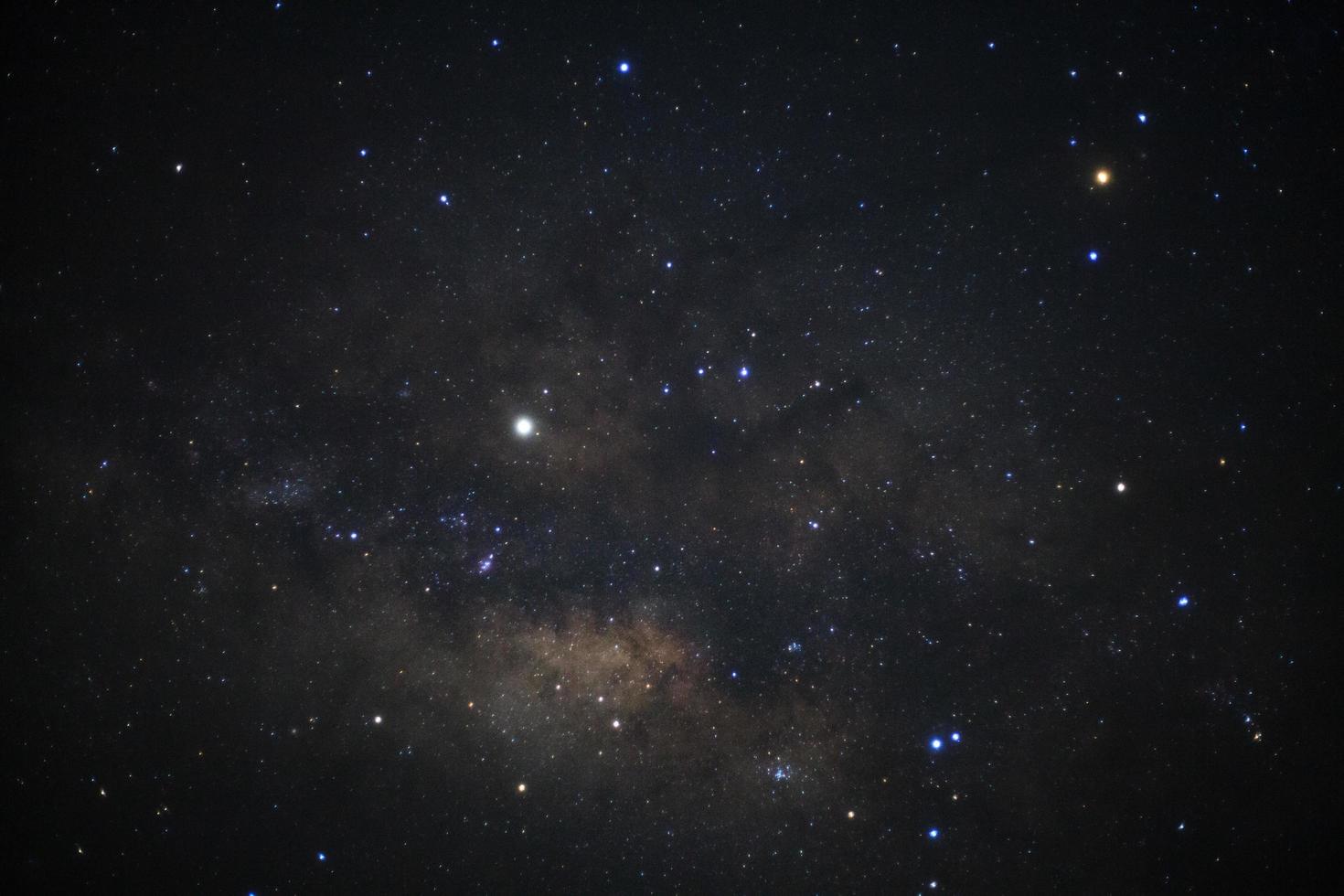 The center of the milky way galaxy with stars and space dust in the universe, Long exposure photograph, with grain photo