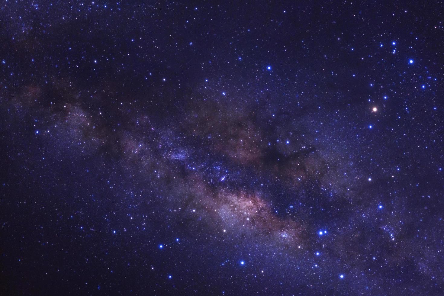 Milky way galaxy with stars and space dust in the universe, Long exposure photograph, with grain. photo