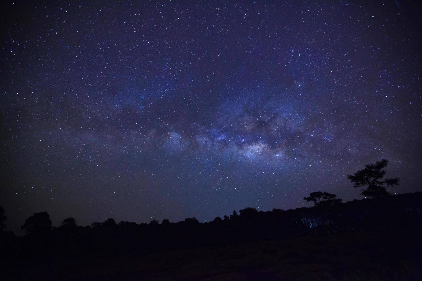 Landscape milky way galaxy with cloud and space dust in the universe, Long exposure photograph, with grain. photo