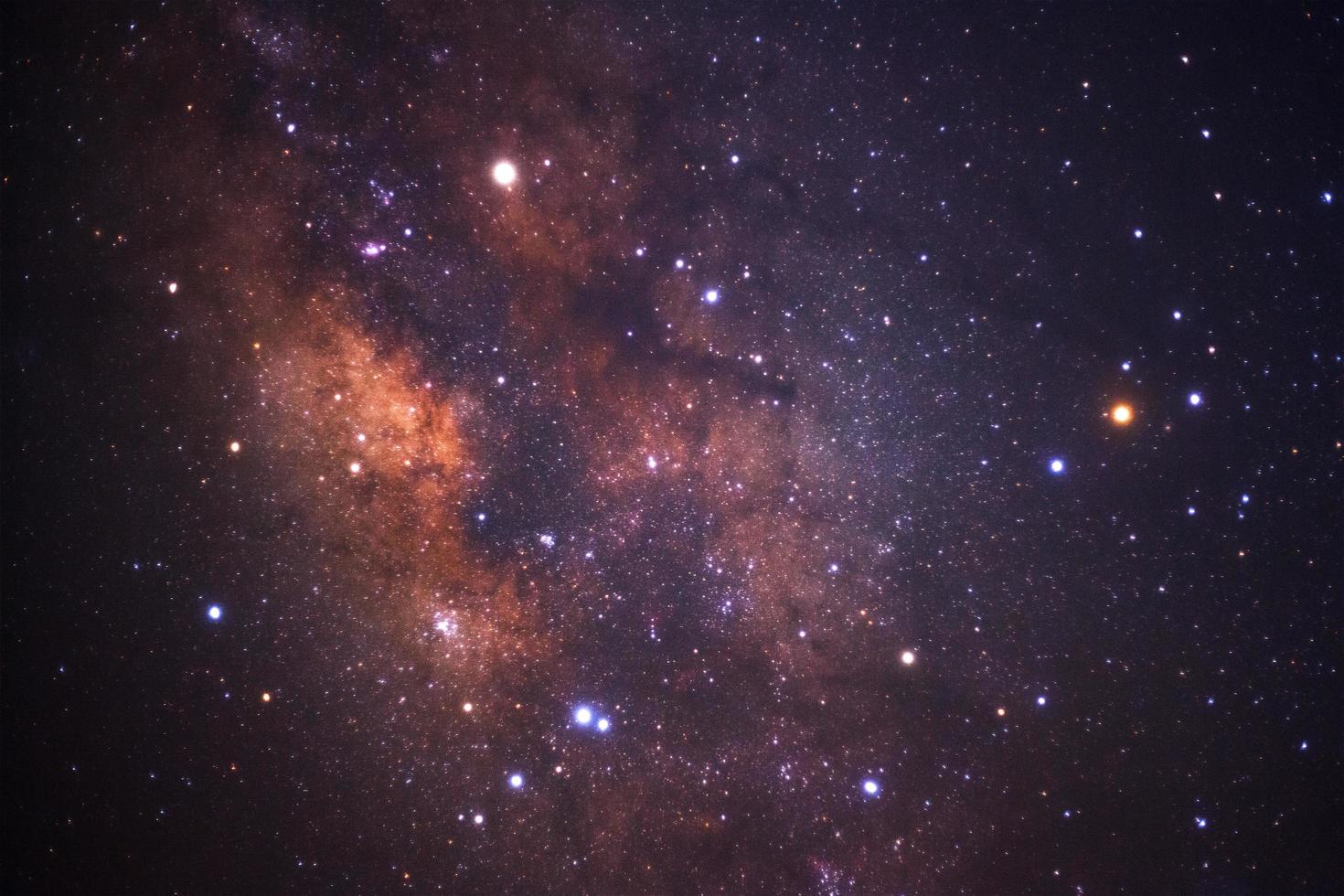 Milky way galaxy with stars and space dust in the universe, Long exposure photograph, with grain. photo