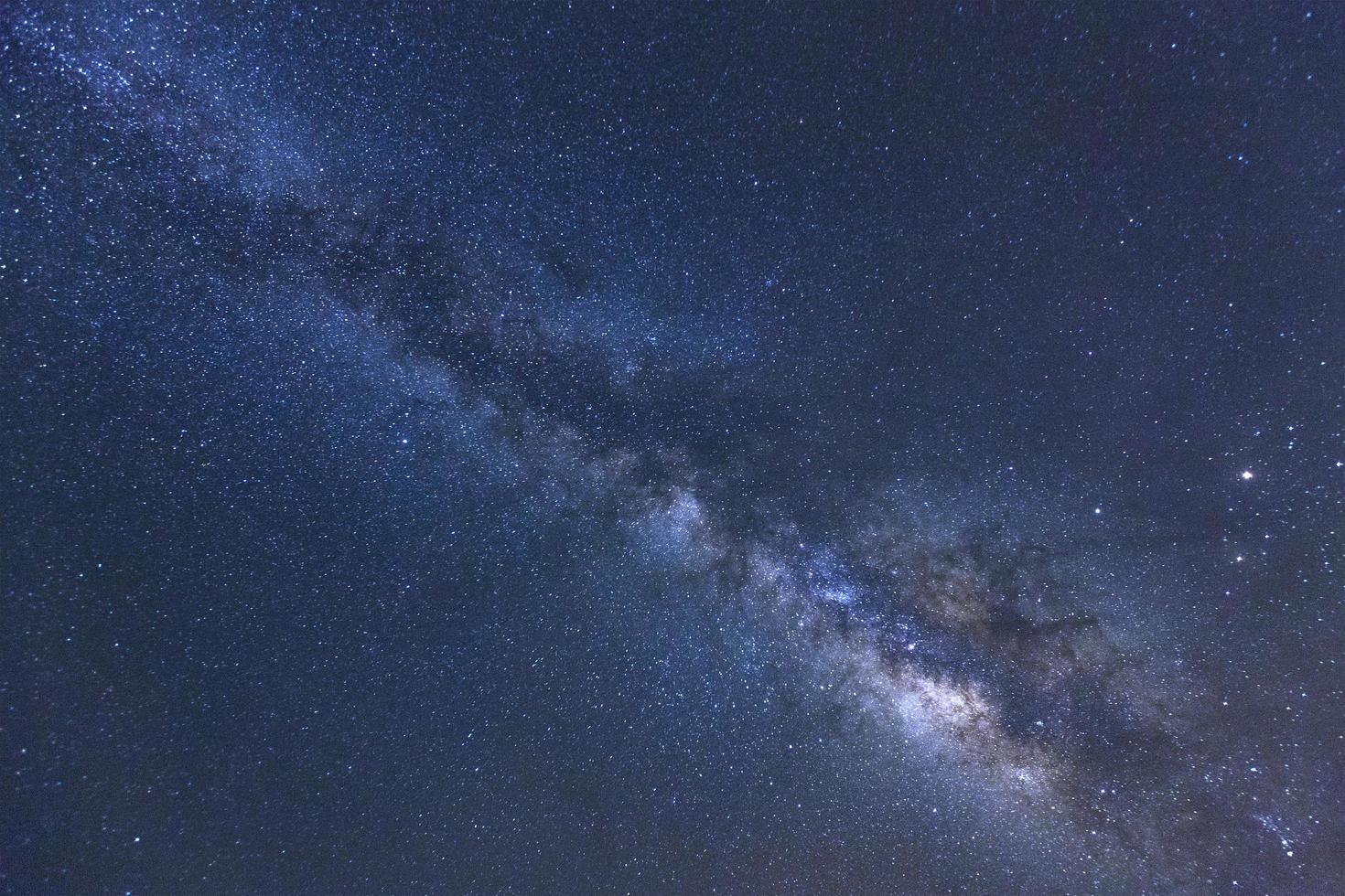 Milky way galaxy with stars and space dust in the universe, Long exposure photograph, with grain. photo