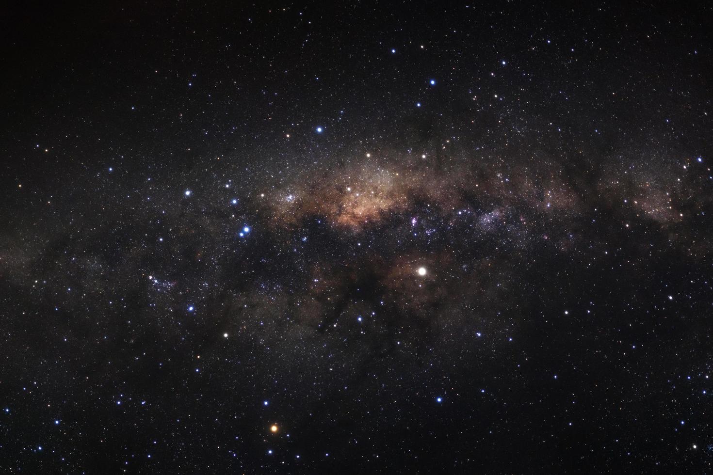 Milky way galaxy with stars and space dust in the universe, Long exposure photograph, with grain. photo
