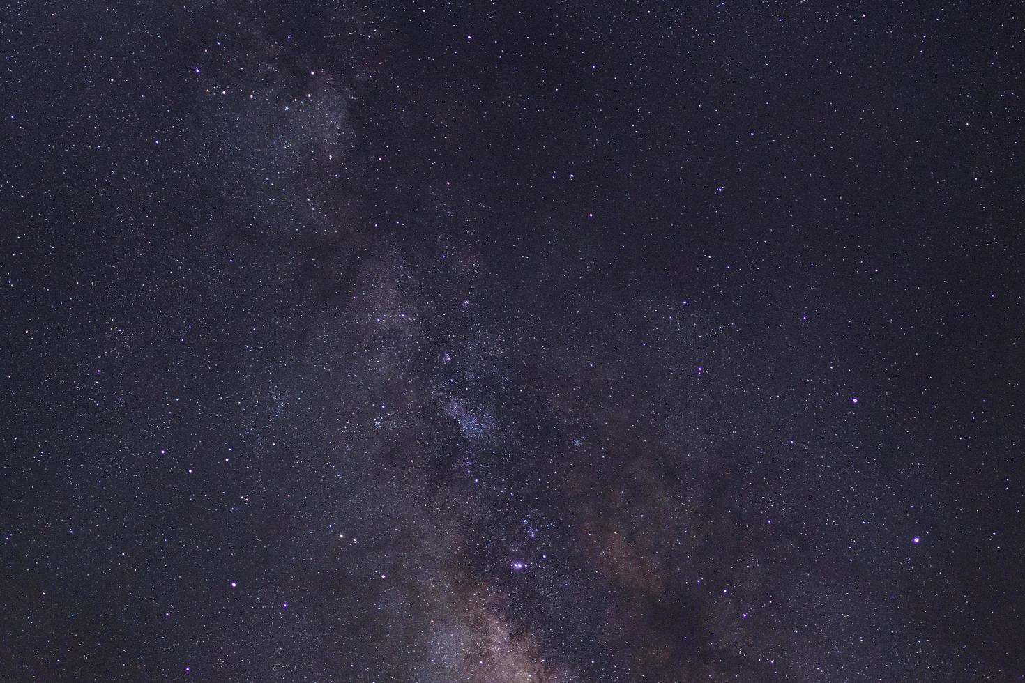 Starry night sky and milky way galaxy with stars and space dust in the universe photo
