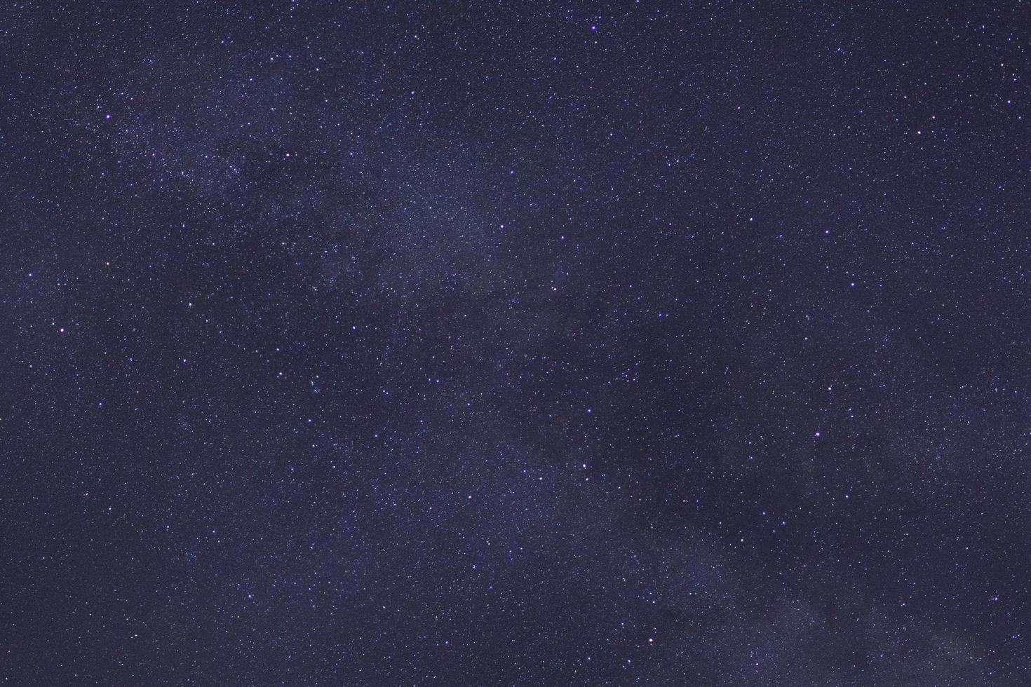 Starry night sky and milky way galaxy with stars and space dust in the universe photo