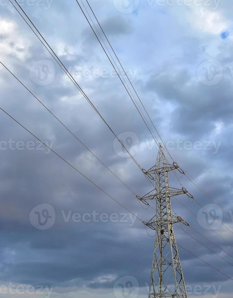 High voltage electric pole and transmission lines. Electricity pylons. Power and energy engineering system. photo