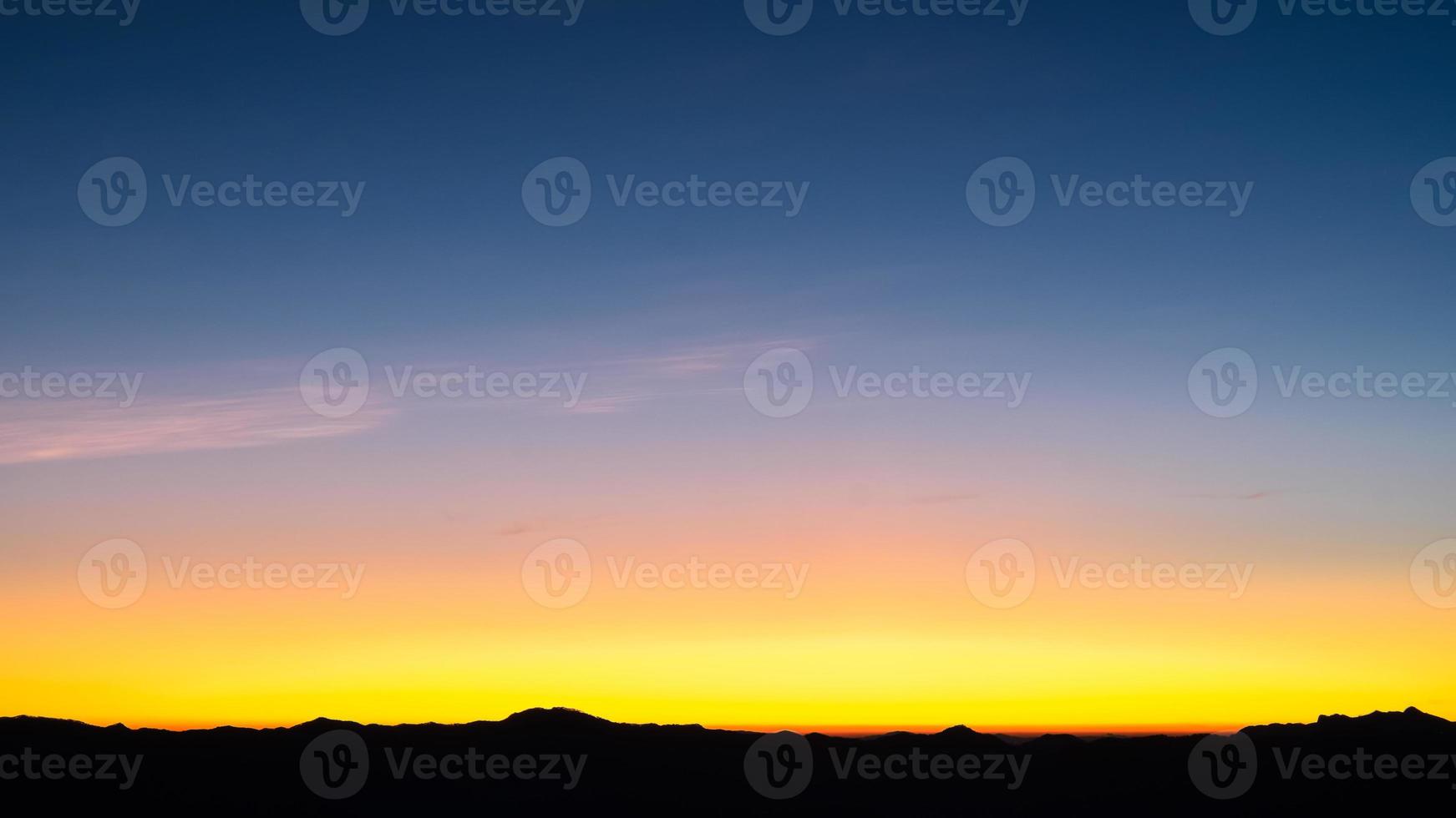 Beautiful bright cloud sky with light for heaven religion background. Sunrise and twilight or sunset cloudscape is orange and blue colours in summer nature. photo