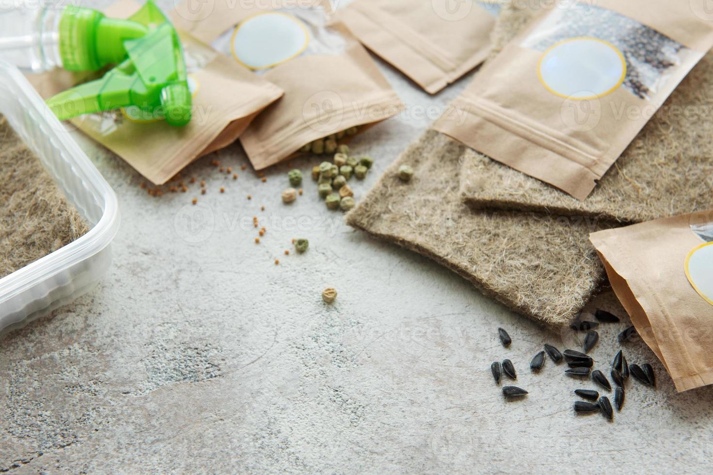 Microgreen seeds in paper bags and equipment for sowing microgreens. photo