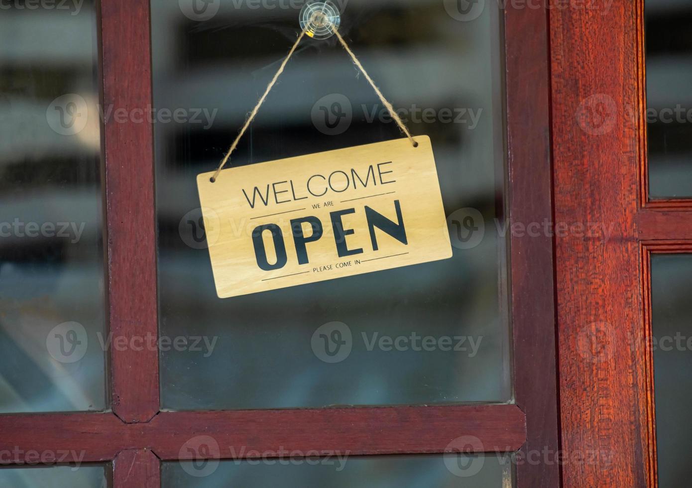 sign come in open on the door of the restaurant. open signboard photo