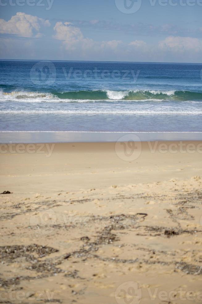 Waves crashing on a beach photo